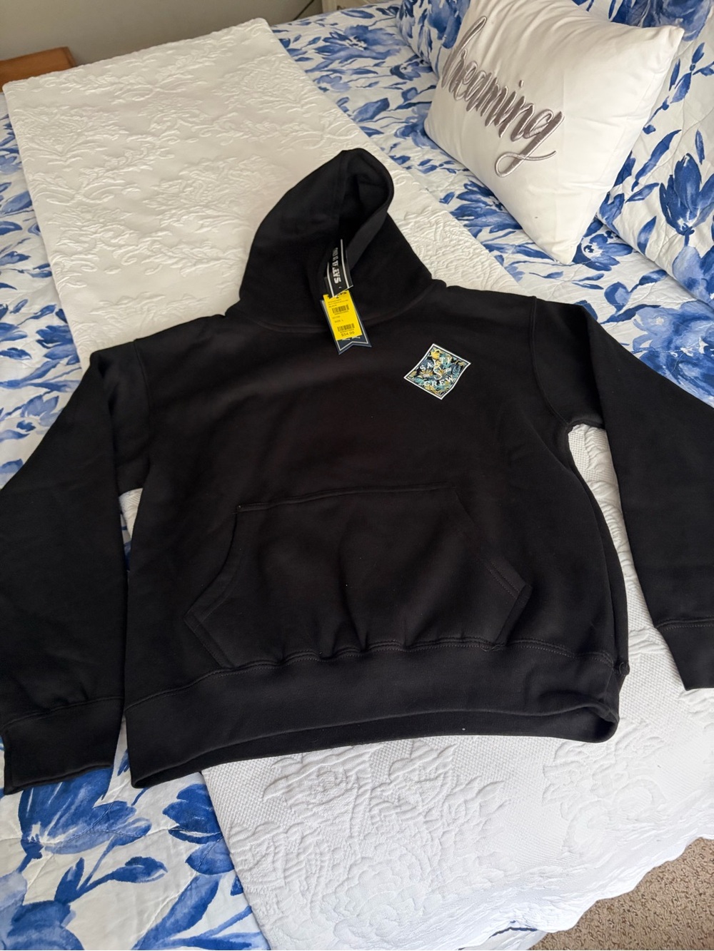 Salty Crew Black Kids Hoodie with Small Surf Patch on chest and design on back.
